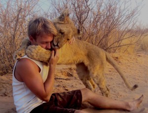 Lion hugging human